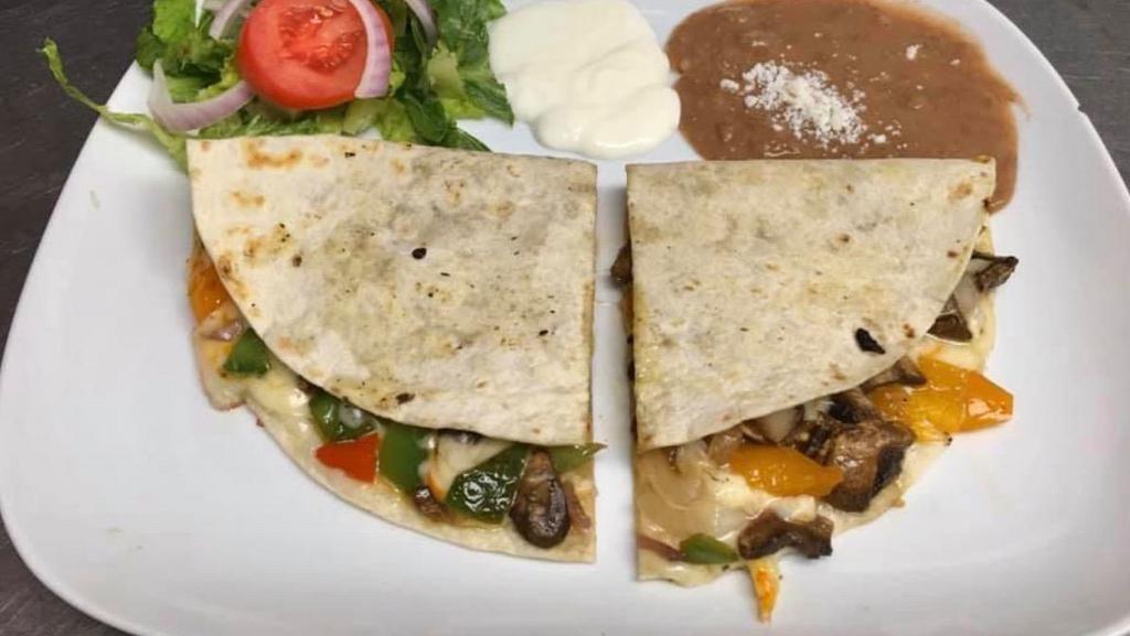 Veggie Quesadilla. · Large flour tortilla with melted cheese and grilled
vegetables (mushrooms, spinach, red onions, and bell
peppers). Served with beans, salad and sour cream.
* -add chicken or carne asada for $2.99