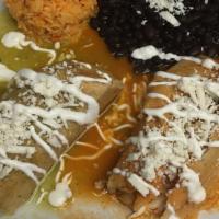 Tamal (2). · (Cooked with pork lard).  Corn dough filled with sauce and shredded chicken or pork or chees...