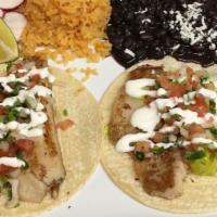 Fish Tacos (2) . · Two soft corn tortillas with fried fish, cabbage , onions, tomatoes and sour cream on top. S...