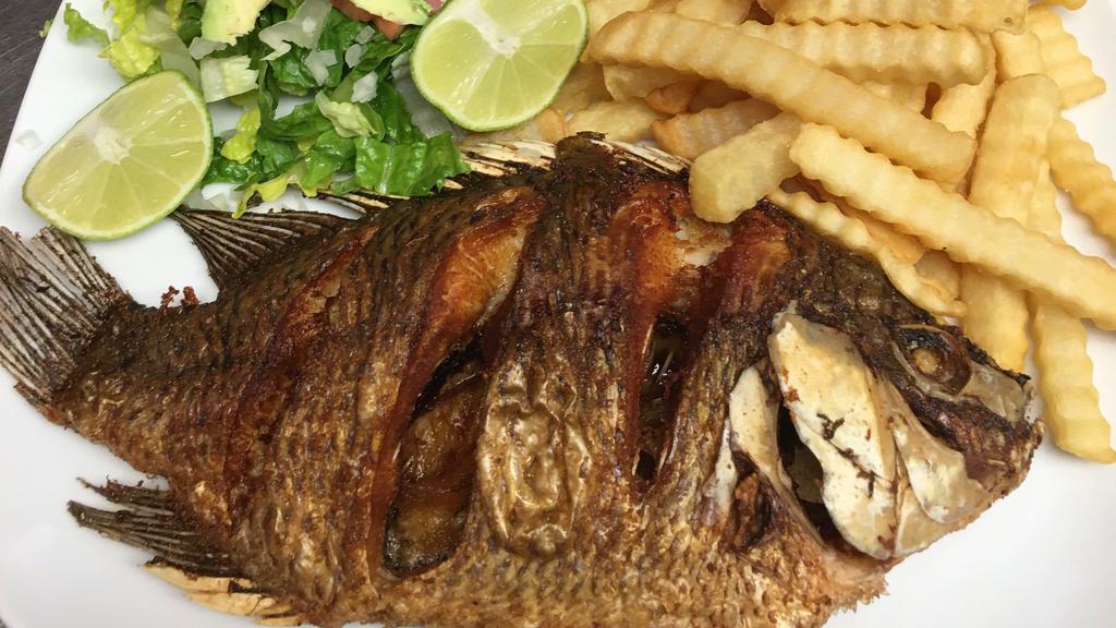 Fried Fish . · Whole Tilapia marinated and fried. Served with fries, whole beans and salad or rice, beans, and salad.