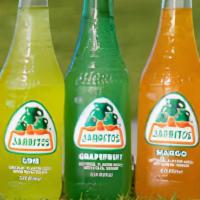 Mexican Soda . · Jarritos (fruit punch,  mandarin, pineapple , tamarind and sparkling water).
Sidral ( apple)
