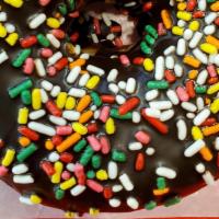 Donuts Mexican Style · Delicious Mexican style donuts covered in chocolate and rainbow sprinkles.