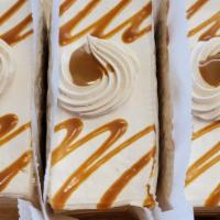 Slice Of Caramel / Dulce De Leche/ Cajeta Tres Leches Cake · A light, airy sponge cake soaked with a mixture of three kinds of milk: evaporated milk, swe...