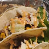 Jerk Chicken Tacos (2) · Marinated spicy jerk chicken breast chunks with all the fixins w/cilantro lime slaw
Trust th...