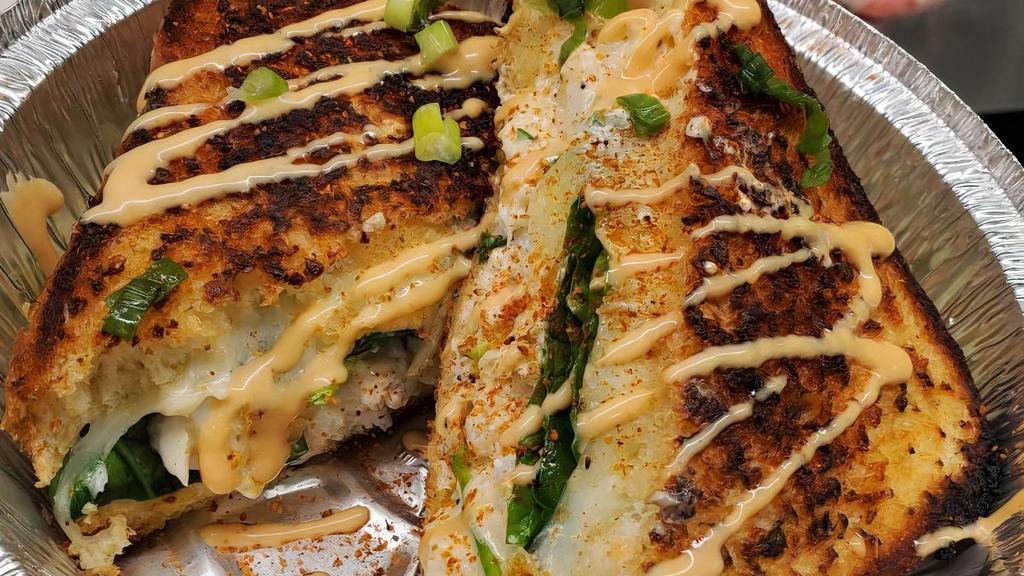 Crab & Spinach Grilled Cheese On Texas Toast · Jumbo Lump Crabmeat on garlic butter Texas toast with garlic cream sauce and ooey gooey provolone cheese
