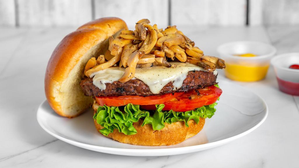 1/2 Lb Piled High Mushroom Burger · 1/2 lb Mushroom Burger piled with grilled mushrooms in our home made garlic parm butter.  Add your favorite toppings of Lettuce, Tomato, Onion, Mayo, Ketchup, Mustard and add carmalized grilled onions to complete the optimal mushroom burger.