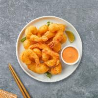 Shrimp Submerged Tempura · (4 Pieces) Shrimp in a light coat of tempura batter, deep-fried until crispy with tempura sa...
