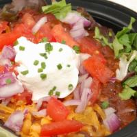 Salad Bowl · Fresh salad greens topped with your  favorite chili (con carne or vegan veggie), tomatoes, o...