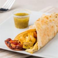 Bacon Egg & Cheese Taco · 2 HUGE fluffy egg with bacon pieces and 4 cheese blend on a flour tortilla.