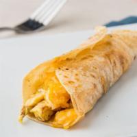 Egg And Cheese Taco · 2 HUGE fluffy eggs with 4 cheese blend and pico de gallo on top a flour tortilla.