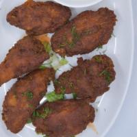 Wings · Deep-fried wings, tossed in buffalo or bbq sauce, served with ranch or blue cheese dressing.