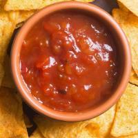 Housemade Salsa · Scratch made house salsa (Pint),  Crispy Tortilla Chips