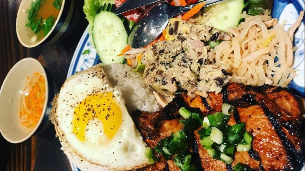 Special Broken Rice Plate · Broken Rice, Sunnyside up Egg, 220g Pork Chop, Shredded Pork Skin, Bake Egg, and a side of salad with a fish sauce for extra flavor.