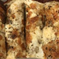 Cheesy Garlic Breadsticks · five cheese blend | fresh garlic & herbs | served with house pizza sauce