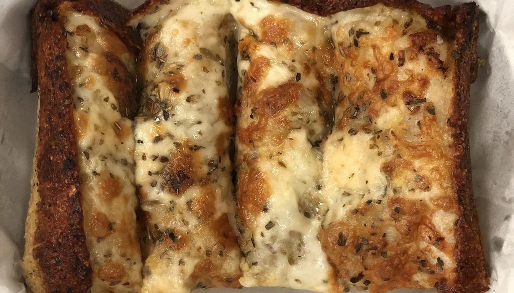 Cheesy Garlic Breadsticks · five cheese blend | fresh garlic & herbs | served with house pizza sauce
