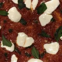 Margherita Pie · house red sauce | fresh mozzarella | basil | evoo | pecorino