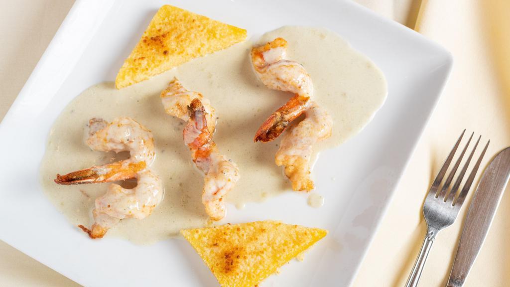 Scampi Gorgonzola · Shrimp encrusted with fresh herbs and breadcrumbs, drizzled with Gorgonzola and served with polenta