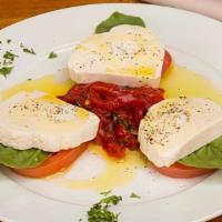 Caprese · fresh mozzarella, seasoned tomatoes, basil pesto