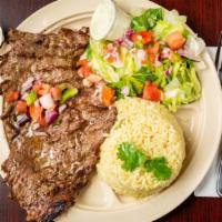Carne Asada · Served with rice and beans, salad, pico de gallo and three corn tortillas.