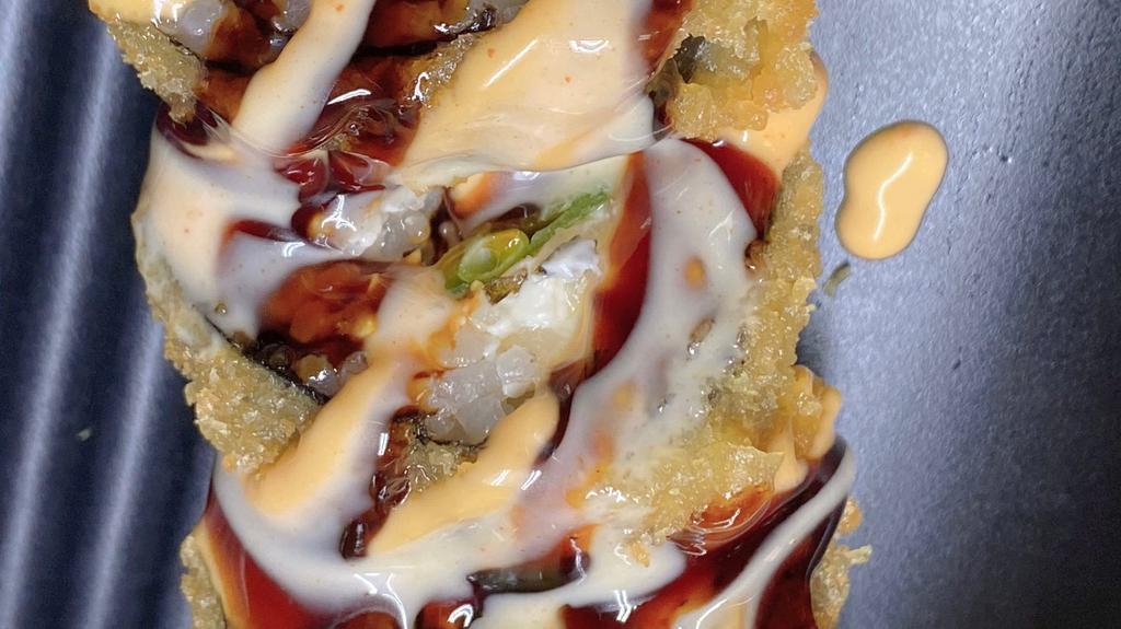 Queen Roll · Deep-fried salmon, cheese snow peas with three kinds topped with yum yum sauce, spicy mayo, eel sauce.