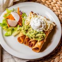 Taquitos · Four rolled corn or flour crispy tortillas filled with our vegetable blend, topped with chee...
