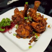 Chicken Lolipop (5 Pcs) · Marinated chicken, wings with onion, garlic, and ginger in medium spicy sauce.