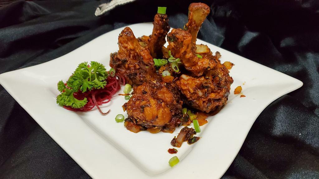 Chicken Lolipop (5 Pcs) · Marinated chicken, wings with onion, garlic, and ginger in medium spicy sauce.