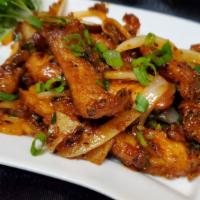 Chili Fish Dry · Tilapia fish with onion ginger onion and bell pepper tossed in oyster sauce.