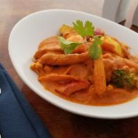 Red Thai Curry  · Mixed vegetables and onions with bell-pepper, bamboo shoots in Coconut milk based curry