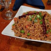 Sichuan Fried Rice  · Basmati fried rice with green peas, onion, carrot, dry chili flakes in sichuan sauce