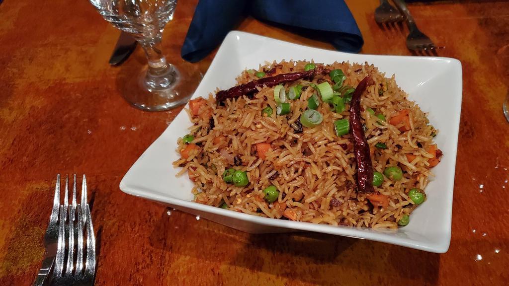 Sichuan Fried Rice  · Basmati fried rice with green peas, onion, carrot, dry chili flakes in sichuan sauce
