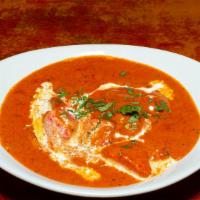 Chicken Tikka Masala  · Tandoor cooked boneless chicken pieces simmered in masala gravy.