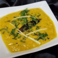 Yellow Dal Tadka  · Yellow lentil tempered with onion tomato & cumin masala