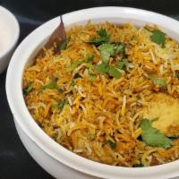 Chicken Biryani  · Medium spicy. Basmati flavored with exotic spices, layered with chicken cooked in a thick gr...