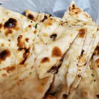 Garlic Naan · Leavened bread with topping.