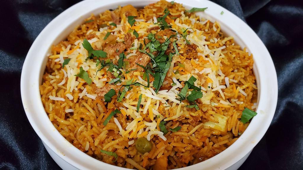 Vegetable Biryani  · Mixed vegetable cooked with basmati rice, flavored with exotic spice.