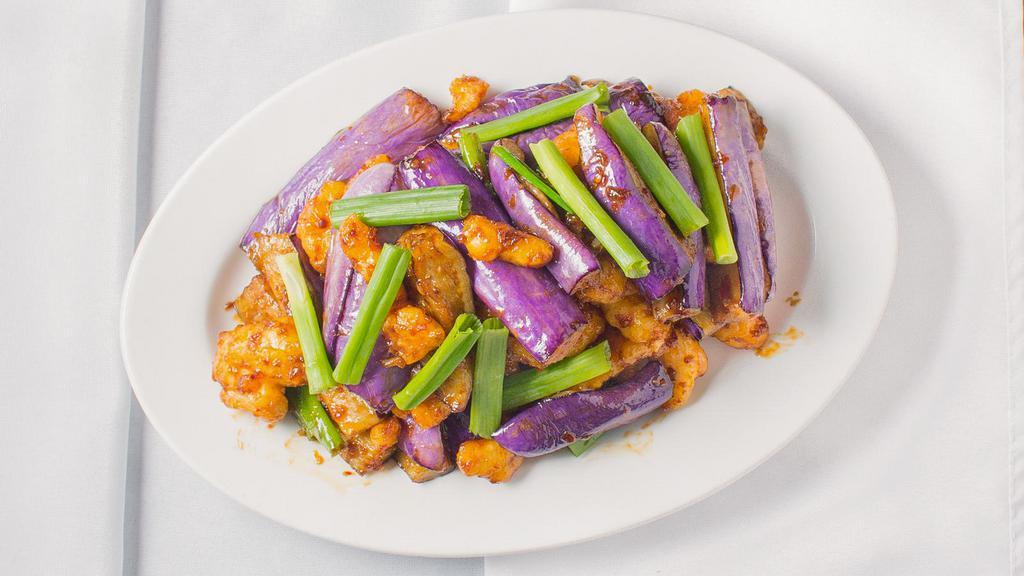 Eggplant Satay Stir Fry · Hot and spicy. Lightly battered chicken prepared with eggplant and scallion in a sweet and spicy brownish-red sauce.