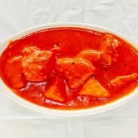 Chicken Tikka Masala · Boneless cubes of chicken grilled in the tandoor. Cooked in a rich, creamy tomato sauce.