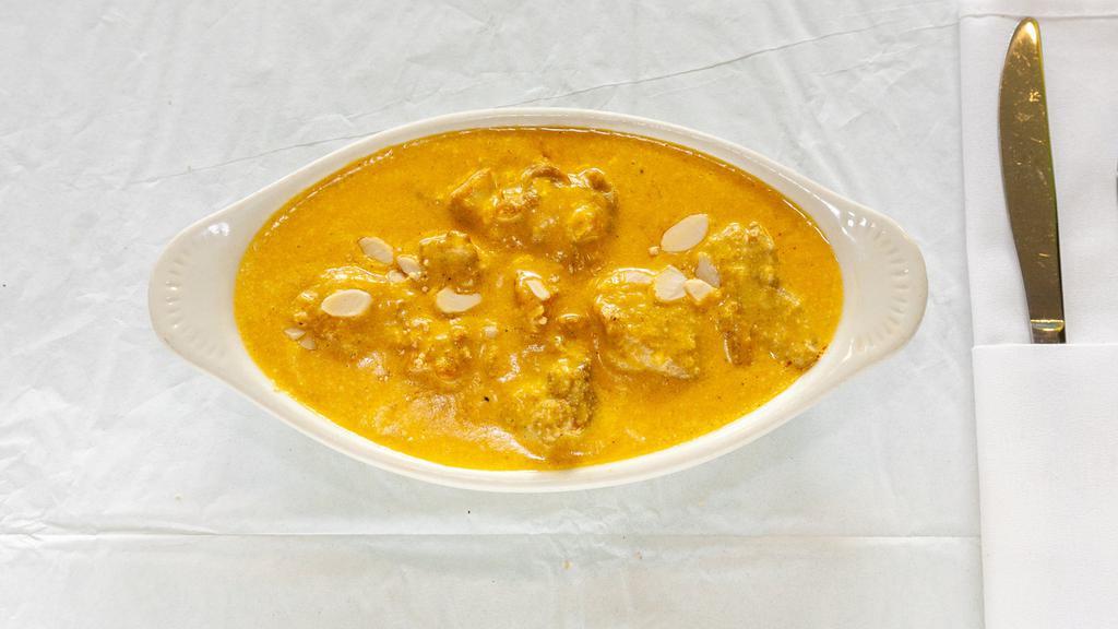 Chicken Korma · Boneless pieces of chicken cooked with raisins and simmered in a smooth almond sauce.