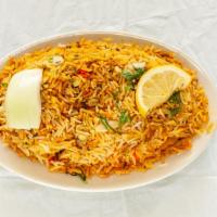 Chicken Biriyani · Steamed basmati rice and chicken cooked together with saffron, raisins, and almonds.
