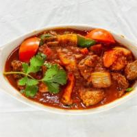 Lamb Karai · Cubes of lamb cooked with spices, herbs, and sauteed with tomatoes, green pepper, and onions...