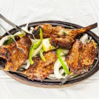 Lamb Chops · Lamb chops marinated in yogurt and spits, succulent and tender from the tandoor oven.
