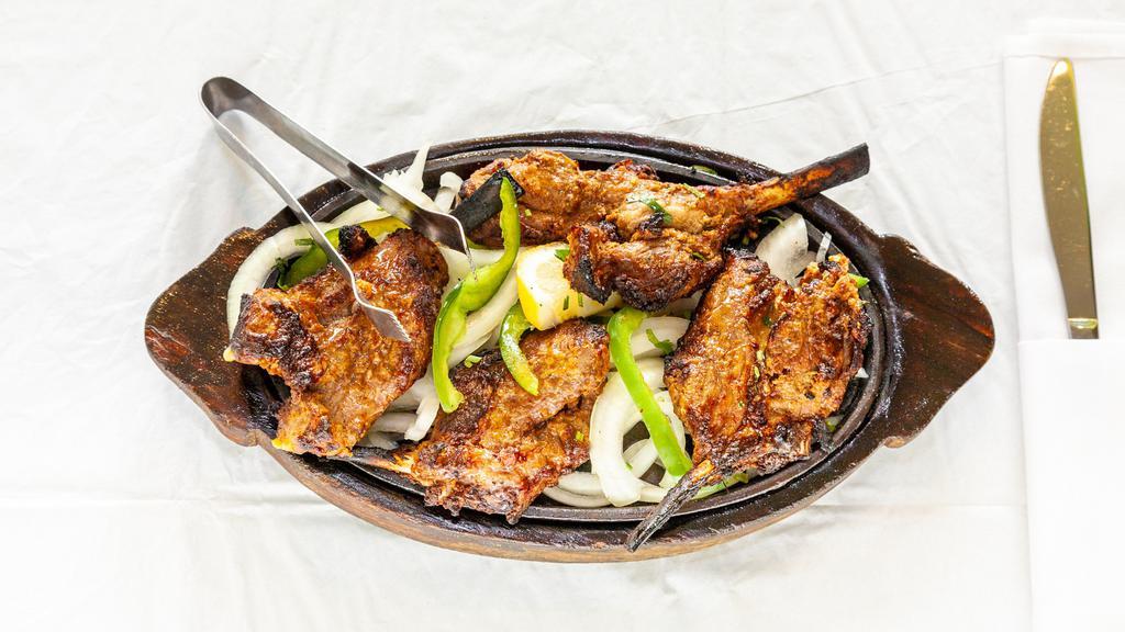 Lamb Chops · Lamb chops marinated in yogurt and spits, succulent and tender from the tandoor oven.