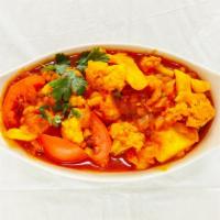Aloo Gobi · Cauliflower and potatoes cooked with tomatoes and spices. Served with bashmoti rice pilaf.