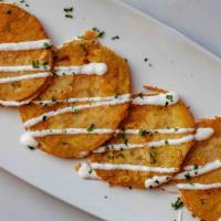 Fried Green Tomatoes · fried green tomatoes with citrus goat cheese crema and spicy remoulade.