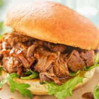 Pulled Pork Sandwich · Juicy and tender shredded Pulled Pork, smoked overnight, and piled high on a sweet brioche b...