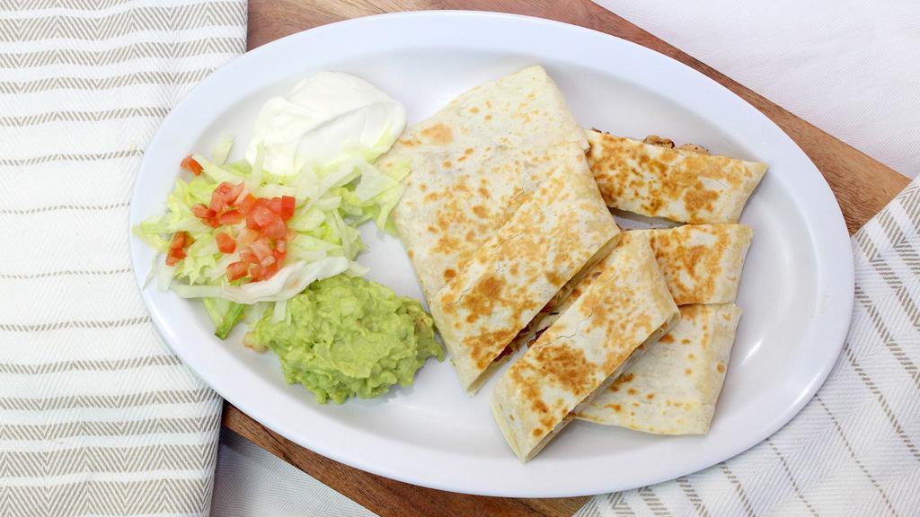 Steak Quesadilla · Grilled steak. Served with guacamole, sour cream and salsa.