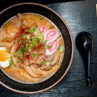 Authentic Japanese Ramen · TONKOTSU:  Chewy wave noodle,fish cakes,bamboo shoots, black galic oil,soy egg & scallion.( ...