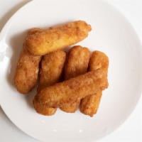 Mozzarella Sticks · Deep-fried cheese sticks. Crispy on the outside, gooey on the inside. Served with a side of ...