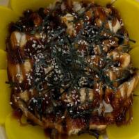 Unagi Donburi · Grilled Eel Over Sushi Rice With oshigo and Dry Seaweed.